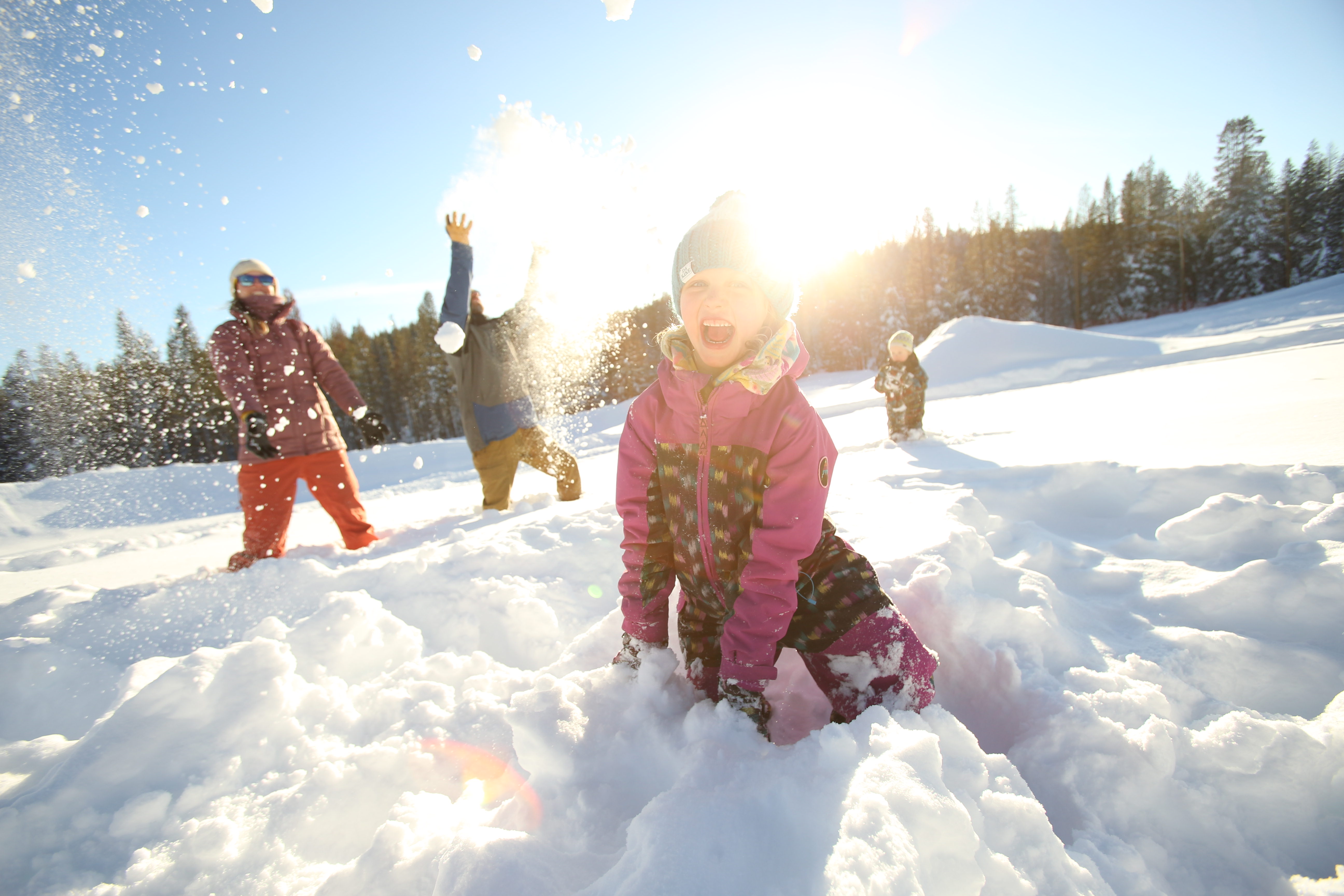 Families enjoying snow tubing at Tahoe Donner Snowplay in Truckee, California