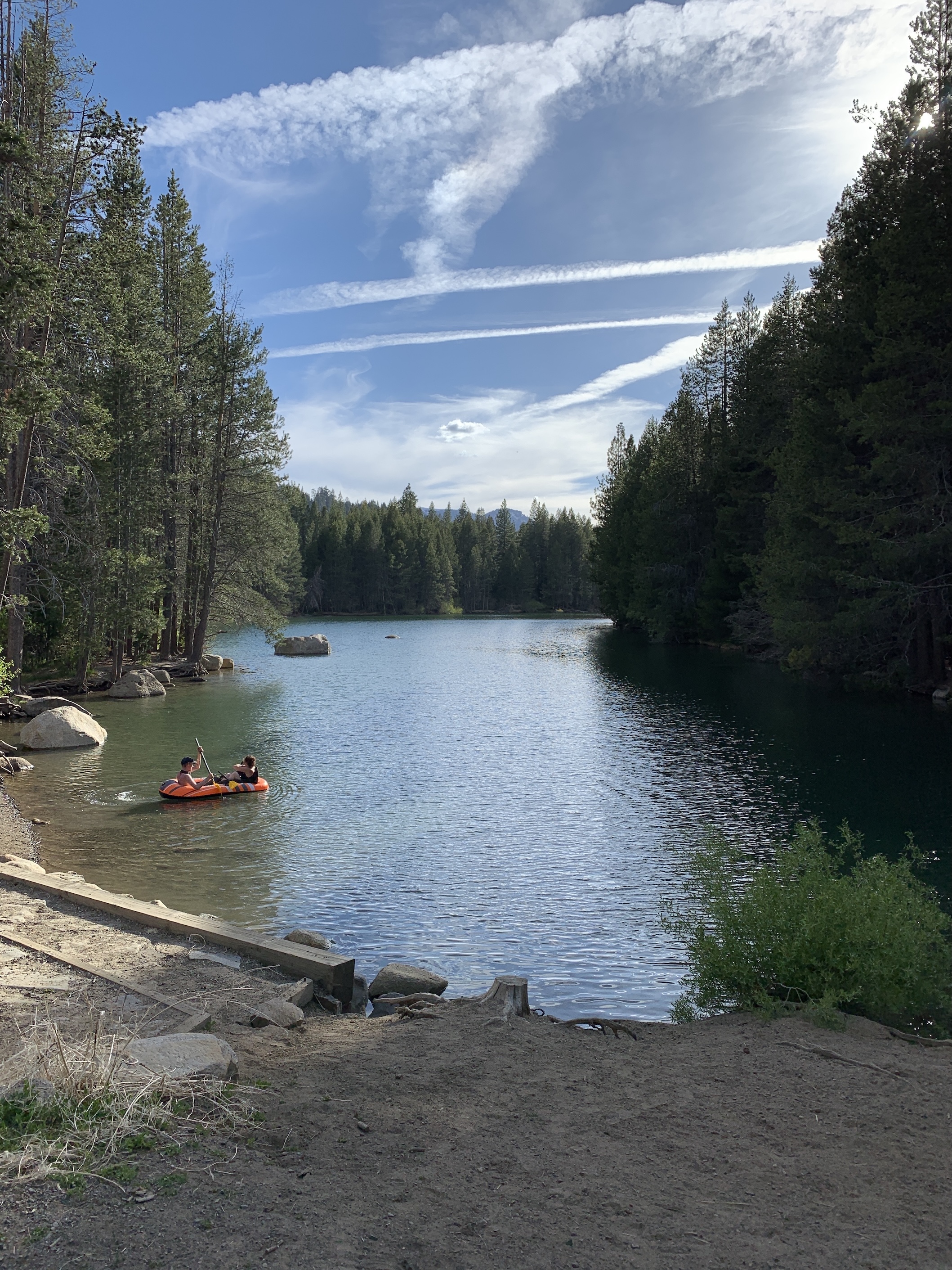 A quiet inlet on Donner Lake with kayaks, canoes, and paddleboats for rent