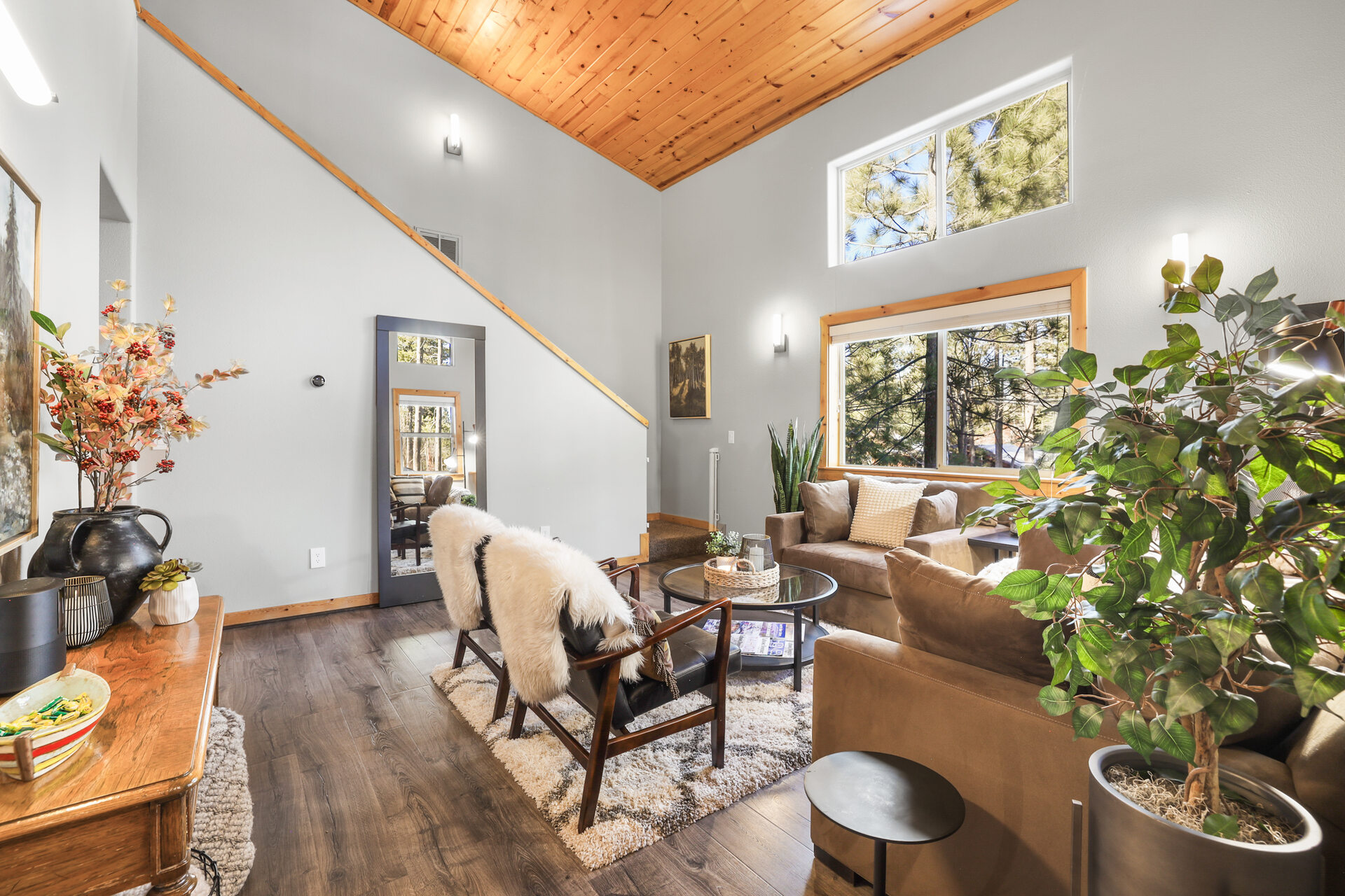 Alderhaus Retreat living room with gas fireplace and vaulted pine ceilings